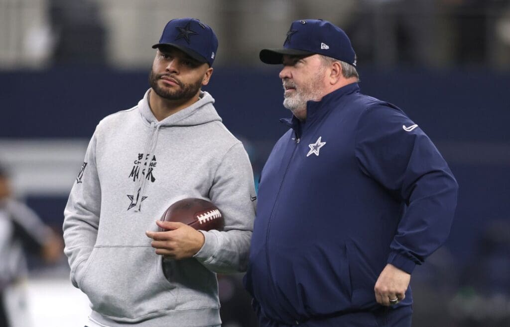 Jan 5, 2025; Arlington, Texas, USA; Dallas Cowboys quarterback Dak Prescott (4) talks to head coach Mike McCarthy before the game against the Washington Commanders at AT&T Stadium.