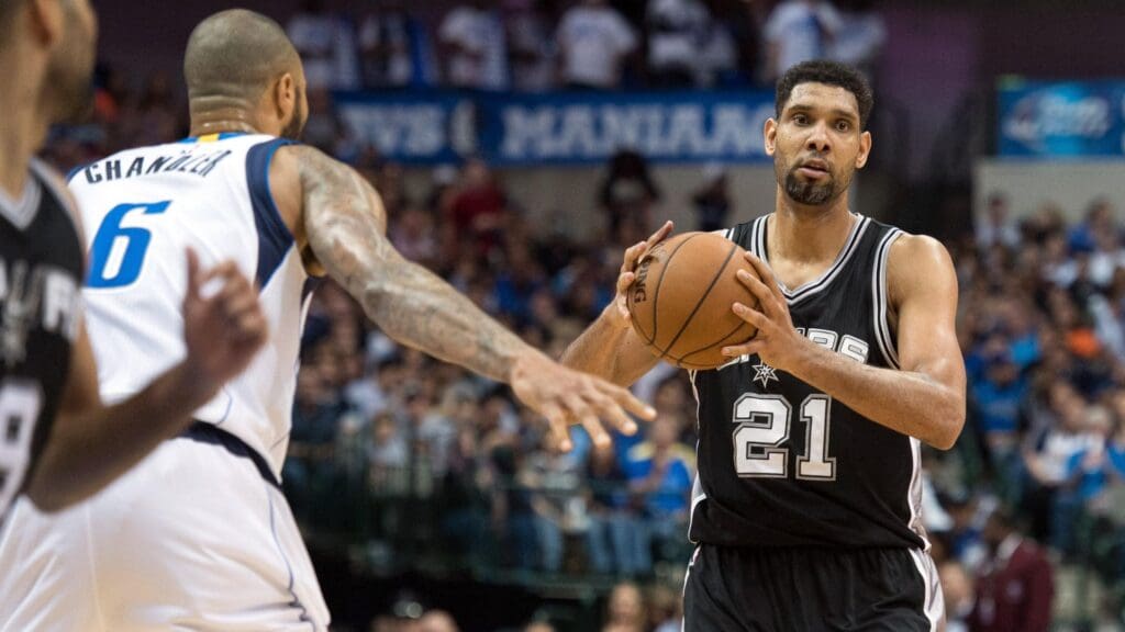Mar 24, 2015; Dallas, TX, USA; Dallas Mavericks center Tyson Chandler (6) guards San Antonio Spurs forward Tim Duncan (21) during the game at the American Airlines Center. The Mavericks defeated the Spurs 101-94