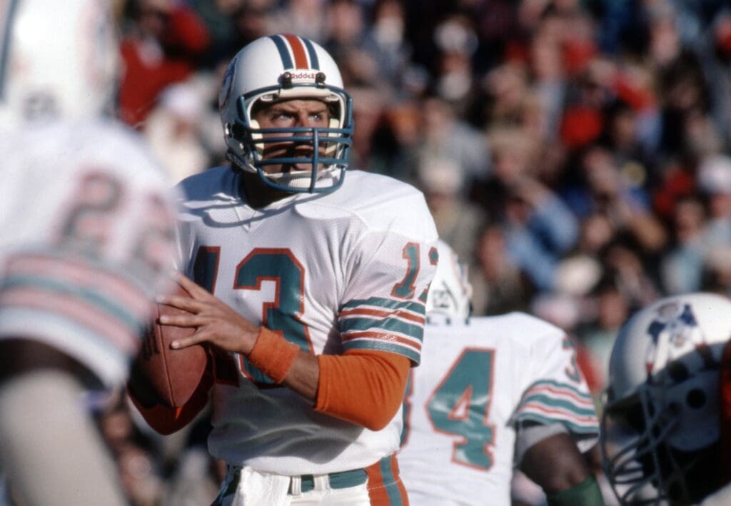 Nov 13, 1983; Foxboro, MA, USA; FILE PHOTO; Miami Dolphins quarterback Dan Marino (13) in action against the New England Patriots at Foxboro Stadium.