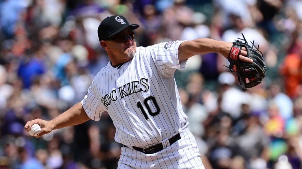 May 19, 2013; Denver, CO, USA; Former Colorado Rockies fielder Dante Bichette (10) throws out the first pitch before the start of the game against the San Francisco Giants at Coors Field.