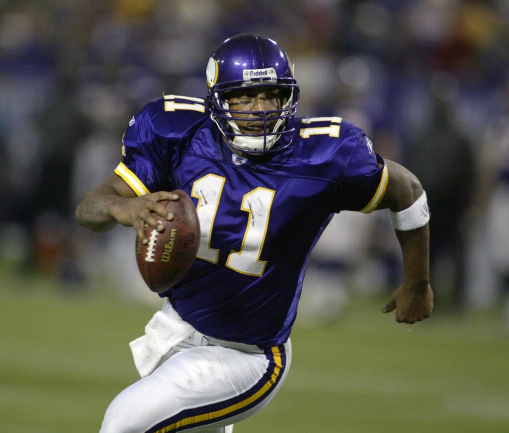 Nov 21, 2004; Minneapolis, MN, USA; Minnesota Vikings quarterback #11 Daunte Culpepper runs to the one-yard line against the Detroit Lions defense in 2nd half action at the Metrodome. The Vikings won 22-19.