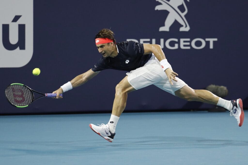 Mar 25, 2019; Miami Gardens, FL, USA; David Ferrer of Spain reaches for a forehand against Frances Tiafoe of the United States (not pictured) in the third round of the Miami Open at Miami Open Tennis Complex.