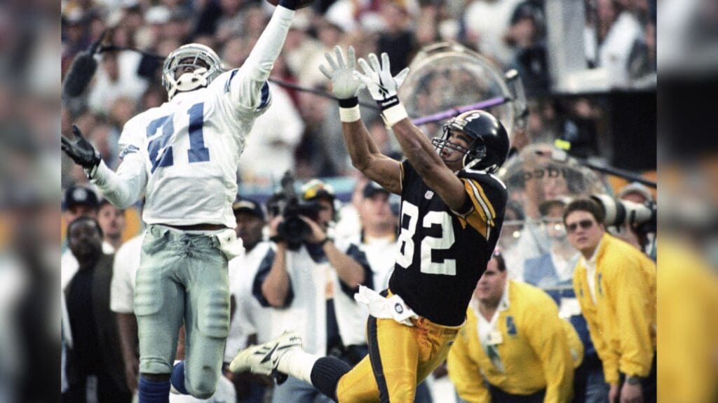 Jan 28, 1996; Tempe, AZ, USA; FILE PHOTO; Dallas Cowboys cornerback Deion Sanders (21) in action against Pittsburgh Steelers receiver Yancey Thigpen (82) during Super Bowl XXX at Sun Devil Stadium. Dallas defeated Pittsburgh 27-17.