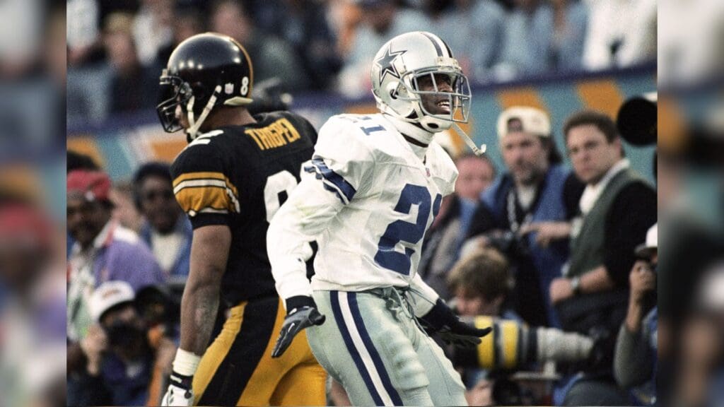 Jan 28, 1996; Tempe, AZ, USA; FILE PHOTO; Dallas Cowboys cornerback Deion Sanders (21) reacts on the field against Pittsburgh Steelers receiver Yancey Thigpen (82) during Super Bowl XXX at Sun Devil Stadium. Dallas defeated Pittsburgh 27-17.