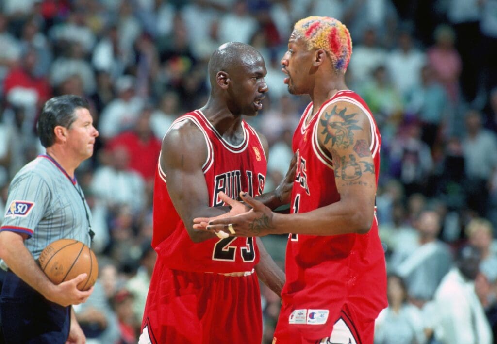 Unknown Date 1997; Miami, FL, USA; FILE PHOTO; Chicago Bulls forward #91 DENNIS RODMAN is held back from the official by guard #23 MICHAEL JORDAN against the Miami Heat at the Miami Arena during the 1996-97 season.