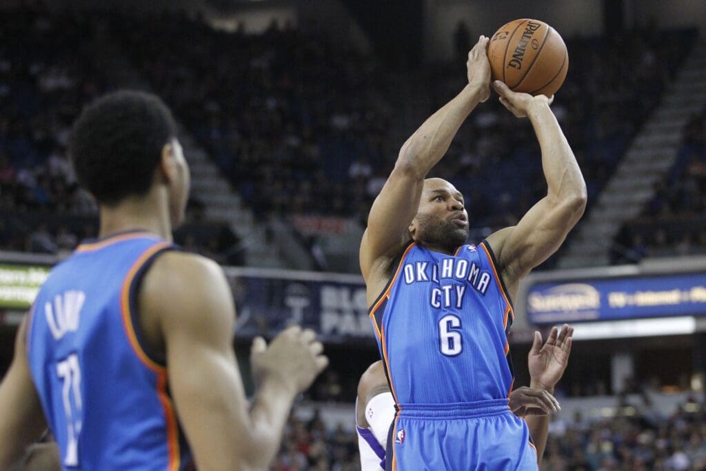 Apr 8, 2014; Sacramento, CA, USA; Oklahoma City Thunder guard Derek Fisher (6) attempts a shot against the Sacramento Kings in the second quarter at Sleep Train Arena.