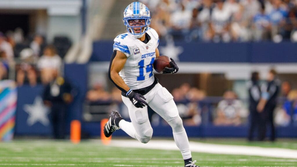 Oct 13, 2024; Arlington, Texas, USA; Detroit Lions wide receiver Amon-Ra St. Brown (14) runs after a catch during the second quarter against the Dallas Cowboys at AT&T Stadium.