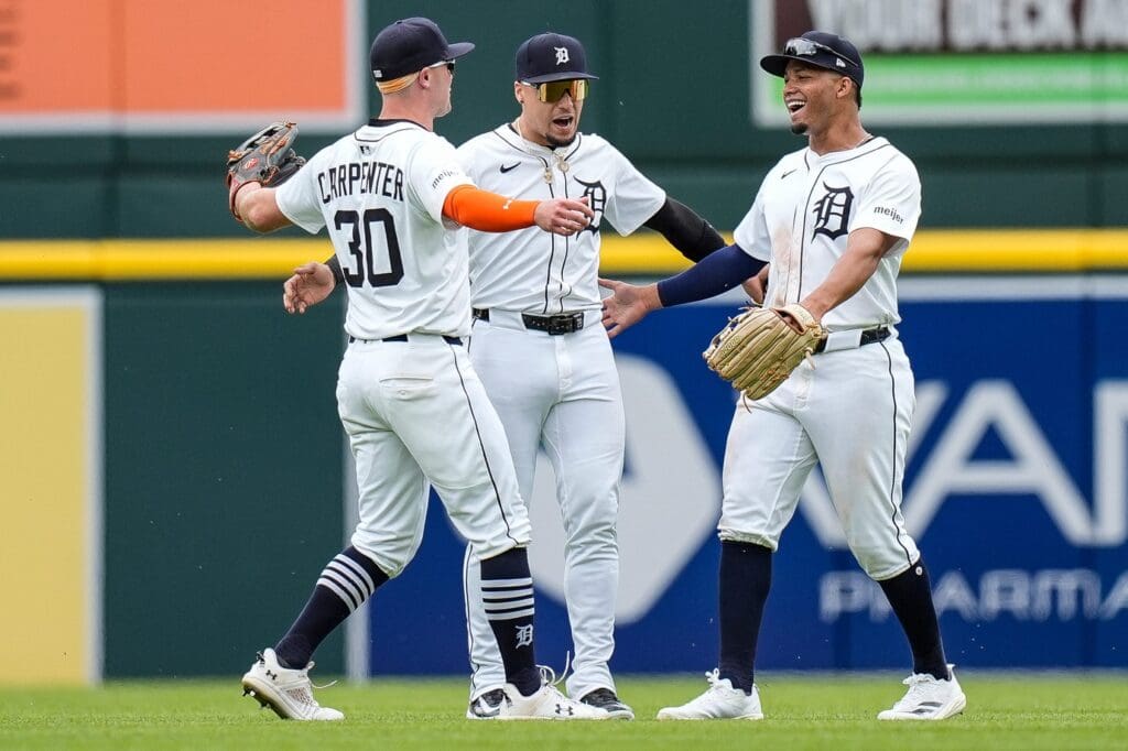From left, Detroit Tigers left fielder Kerry Carpenter (30), outfielder Javier Báez (28), and center fielder Wenceel Pérez (46) celebrate 4-3 win over San Francisco Giants at Comerica Park in Detroit on Wednesday, May 28, 2025