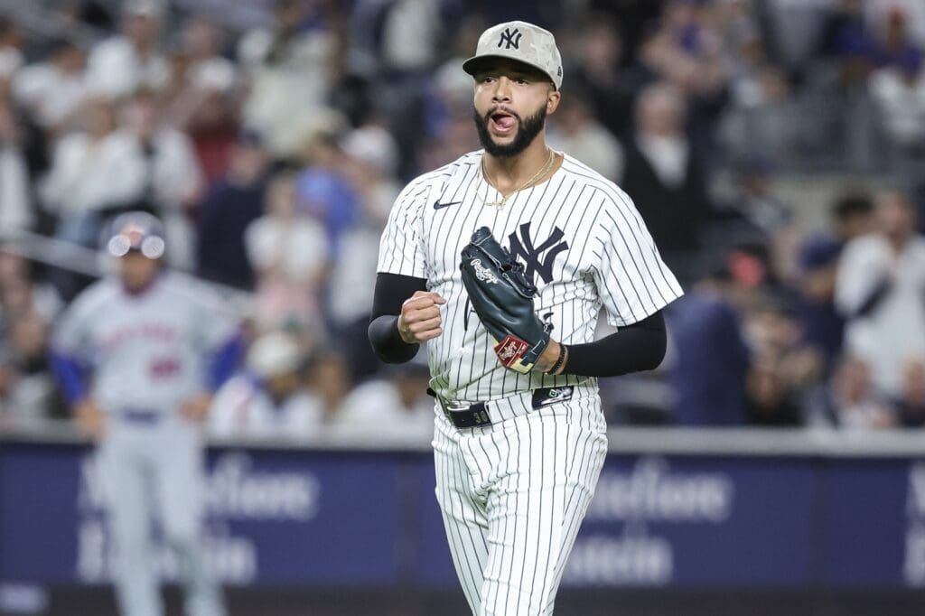 May 18, 2025; Bronx, New York, USA; New York Yankees relief pitcher Devin Williams (38) reacts after retiring the side in the eighth inning against the New York Mets at Yankee Stadium. Mandatory Credit: Wendell Cruz-Imagn Images