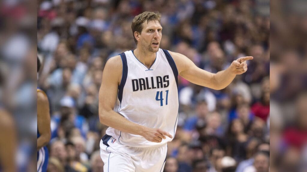 Mar 21, 2017; Dallas, TX, USA; Dallas Mavericks forward Dirk Nowitzki (41) celebrates making a three point shot against the Golden State Warriors during the second half at the American Airlines Center. The Warriors defeat the Mavericks 112-87.