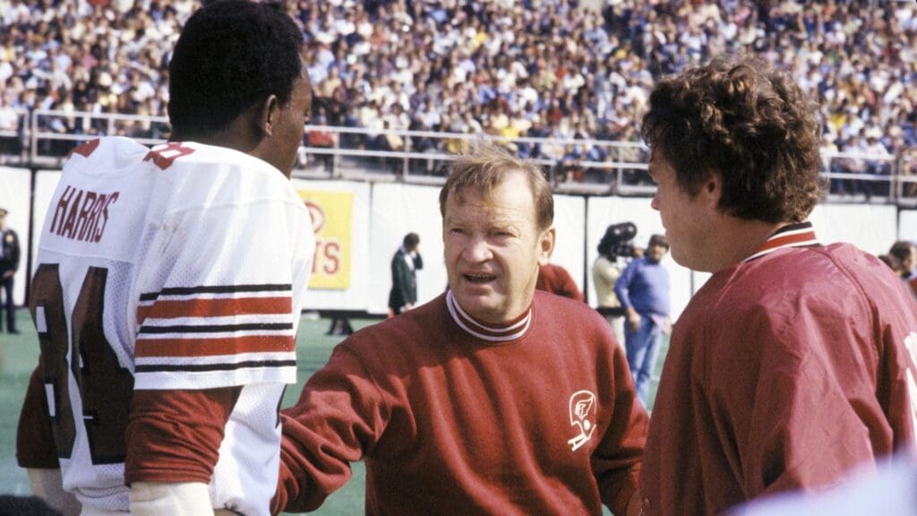 Oct 16, 1977; Philadelphia, PA, USA; FILE PHOTO;St. Louis Cardinals head coach Don Coryell (center) talks with receiver Ike Harris (84) on the sideline against the Philadelphia Eagles at Veterans Stadium.