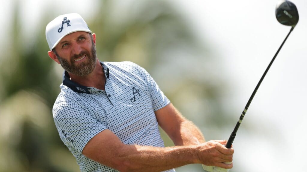 Apr 6, 2025; Miami, Florida, USA; Dustin Johnson watches his shot from the second tee during the final round of the LIV Golf Miami golf tournament at Trump National Doral.