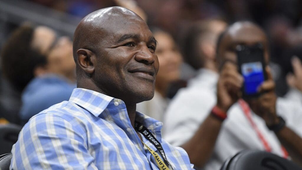 Apr 3, 2019; Atlanta, GA, USA; Former heavy weight boxing champion Evander Holyfield shown watching the game between the Atlanta Hawks against the Philadelphia 76ers during the second half at State Farm Arena