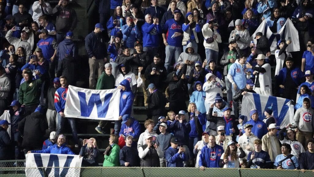 May 5, 2025; Chicago, Illinois, USA; Fans celebrate the Chicago Cubs win against the San Francisco Giants at Wrigley Field.