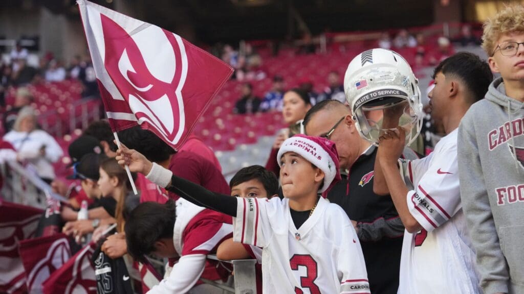 Fans gather in the stands before the Arizona Cardinals play the New England Patriots at State Farm Stadium on Dec. 15, 202