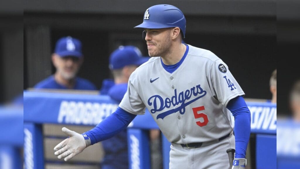 May 27, 2025; Cleveland, Ohio, USA; Los Angeles Dodgers first baseman Freddie Freeman (5) reacts after watching designated hitter Shohei Ohtani (not pictured) hit a two-run home run in the fourth inning against the Cleveland Guardians at Progressive Field.