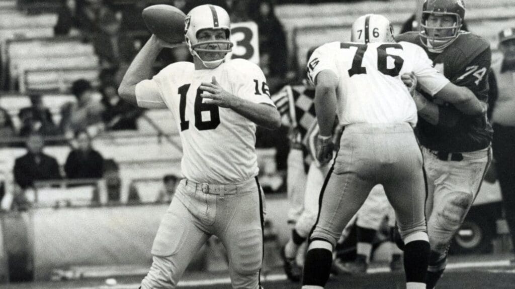 Nov 23, 1967; Kansas City, MO, USA; FILE PHOTO; Oakland Raiders quarterback George Blanda (16) looks to throw as Kansas City Chiefs defensive end Gene Trosch (74) at Municipal Stadium. Oakland defeated Kansas City 44-22.