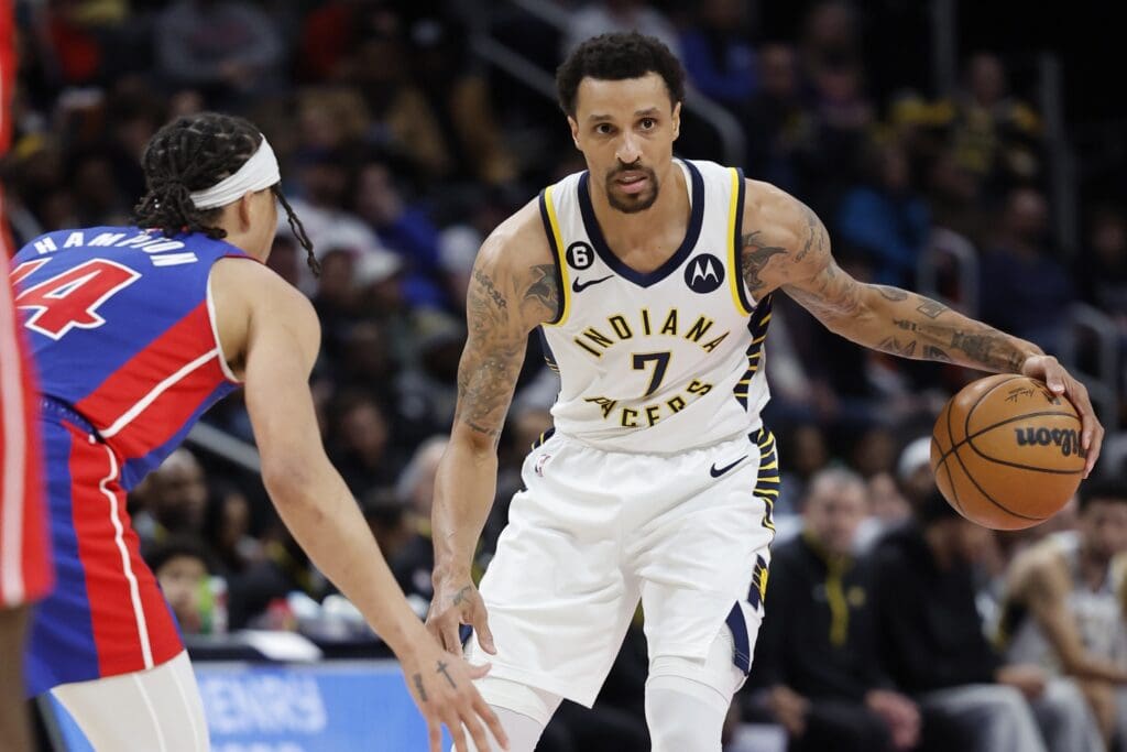 Mar 11, 2023; Detroit, Michigan, USA; Indiana Pacers guard George Hill (7) dribbles the ball against Detroit Pistons guard R.J. Hampton (14) in the second half at Little Caesars Arena.