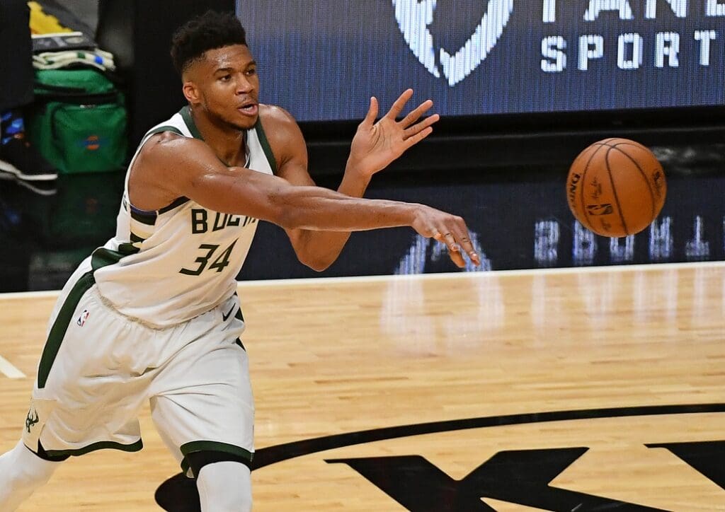 Dec 29, 2020; Miami, Florida, USA; Milwaukee Bucks forward Giannis Antetokounmpo (34) passes the ball during the second half against the Miami Heat at American Airlines Arena.