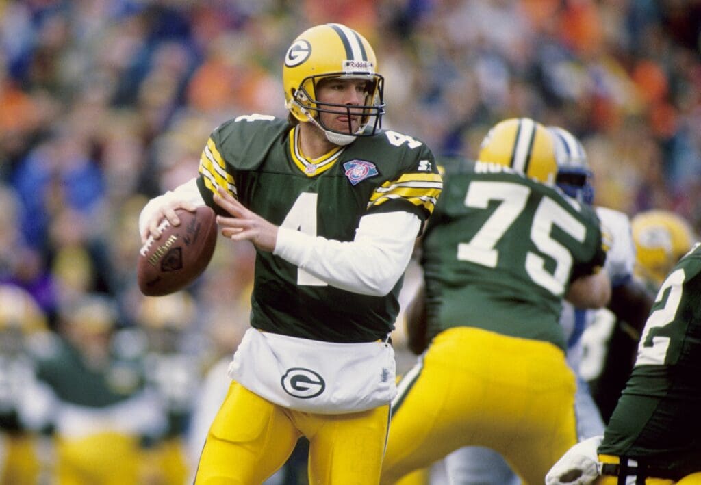 Dec 31, 1994, Green Bay, WI, USA; FILE PHOTO; Green Bay Packers quarterback Brett Favre (4) prepares to throw against the Detroit Lions at Lambeau Field during the NFC Wild Card Game. The Packers defeated the Lions 16-12.