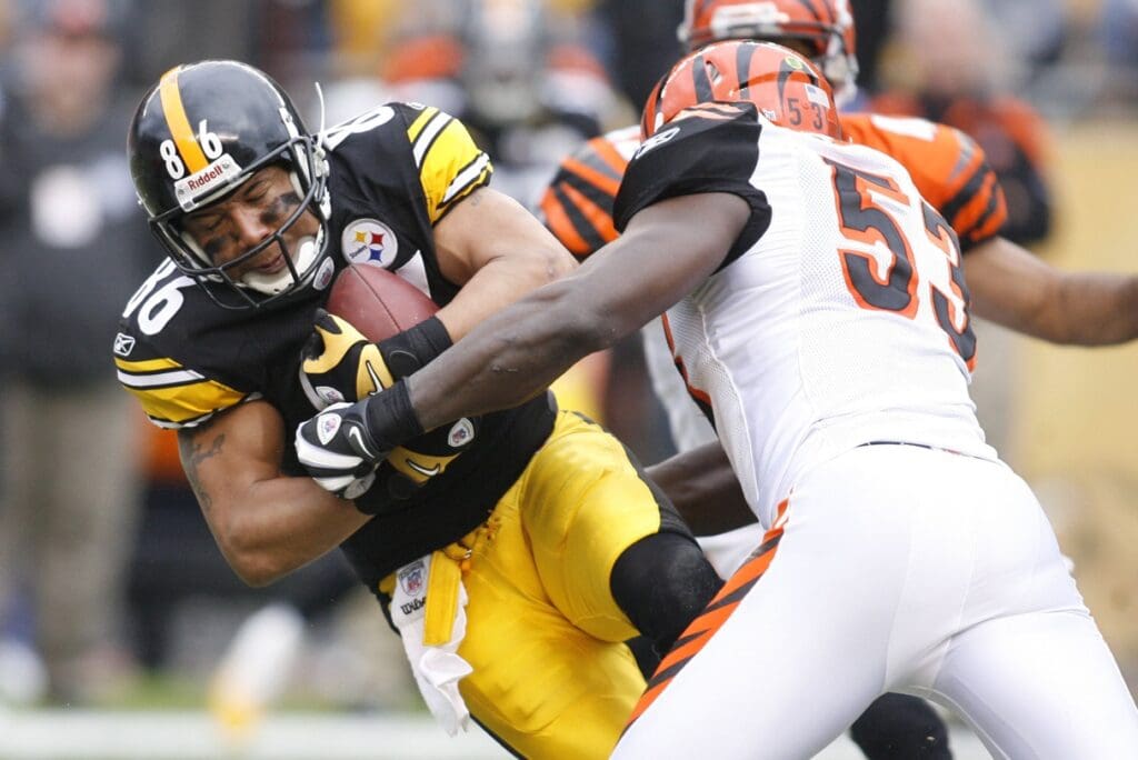 December 4, 2011; Pittsburgh,PA, USA: Pittsburgh Steelers receiver Hines Ward (86) makes a catch against Cincinnati Bengals linebacker Thomas Howard (53) during the second quarter at Heinz Field. Mandatory Credit: Charles LeClaire-USPRESSWIRE