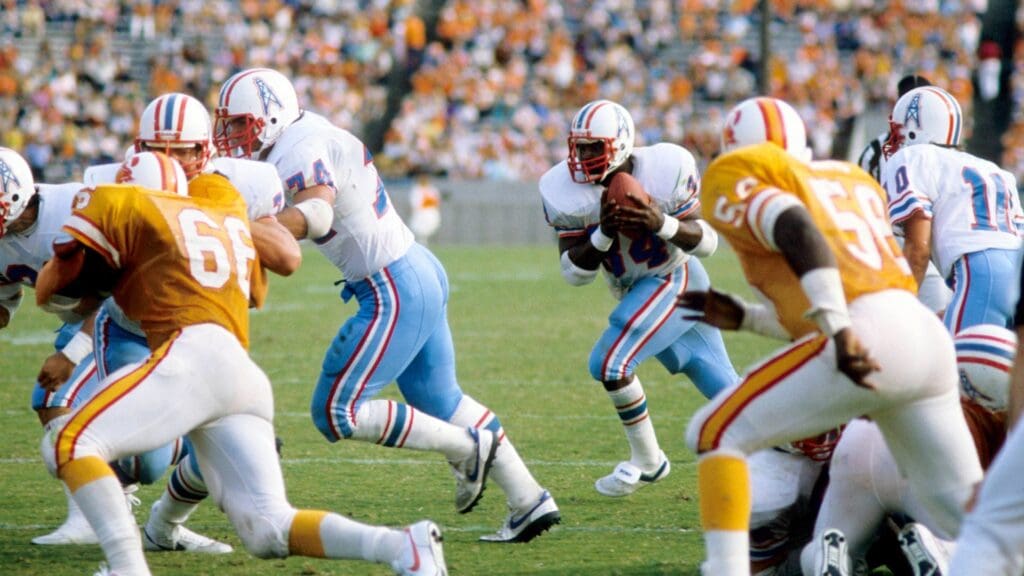 Nov 27, 1983; Tampa, FL, USA; FILE PHOTO; Houston Oilers running back Earl Campbell (34) carries the ball against the Tampa Bay Buccaneers at Tampa Stadium