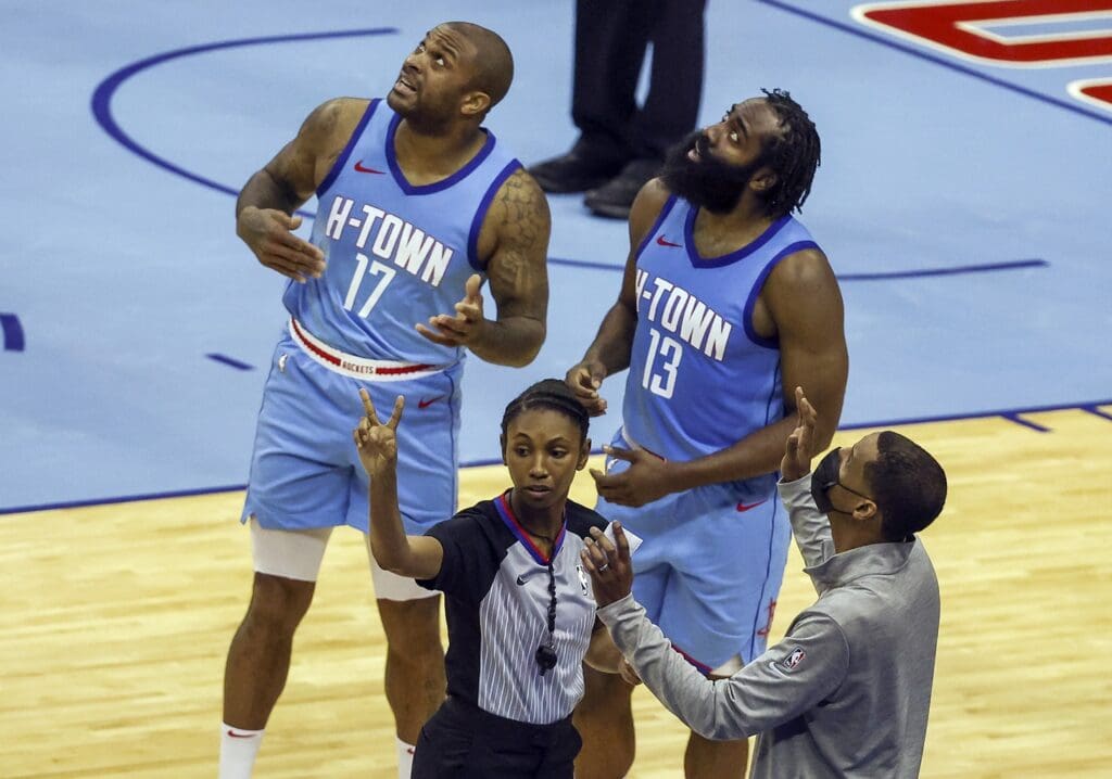 Jan 12, 2021; Houston, Texas, USA; Houston Rockets forward P.J. Tucker (17) and guard James Harden (13) and Rockets head coach Stephen Silas (right) react after a call during the third quarter against the Los Angeles Lakers at Toyota Center.