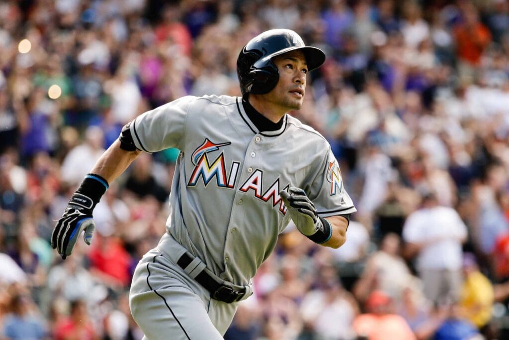 Aug 7, 2016; Denver, CO, USA; Miami Marlins center fielder Ichiro Suzuki (51) watches his ball on a triple in the seventh inning against the Colorado Rockies at Coors Field.