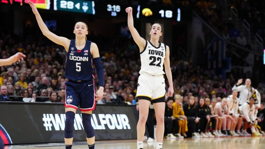 Apr 5, 2024; Cleveland, OH, USA; Iowa Hawkeyes guard Caitlin Clark (22) and Connecticut Huskies guard Paige Bueckers (5) react in the second quarter in the semifinals of the Final Four of the womens 2024 NCAA Tournament at Rocket Mortgage FieldHouse.