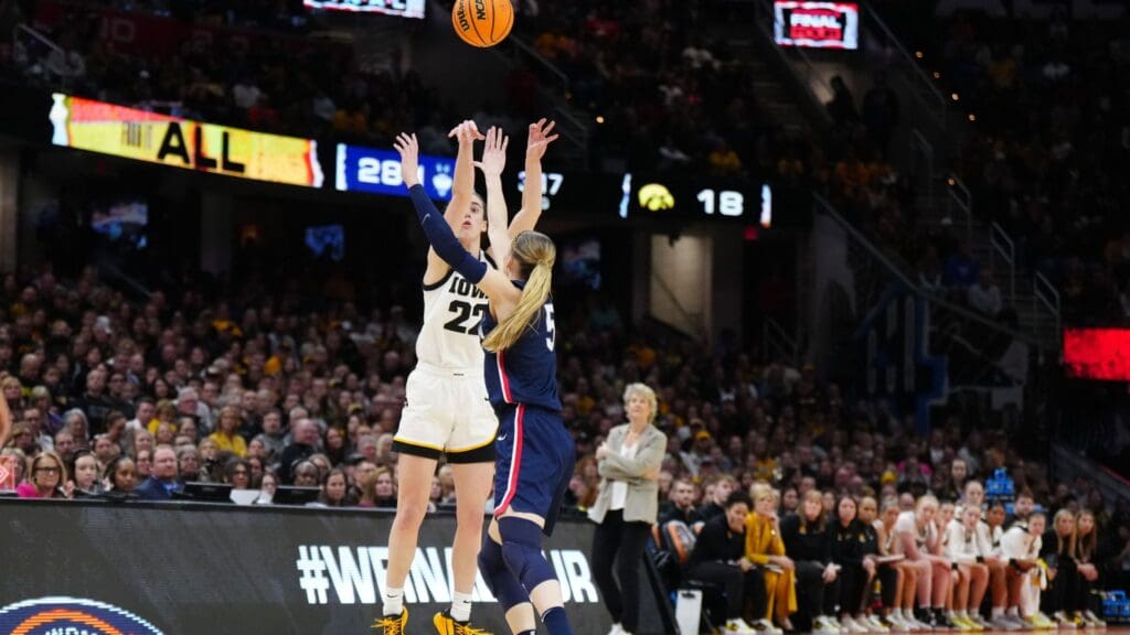 Apr 5, 2024; Cleveland, OH, USA; Iowa Hawkeyes guard Caitlin Clark (22) shoots against Connecticut Huskies guard Paige Bueckers (5) in the second quarter in the semifinals of the Final Four of the womens 2024 NCAA Tournament at Rocket Mortgage FieldHouse