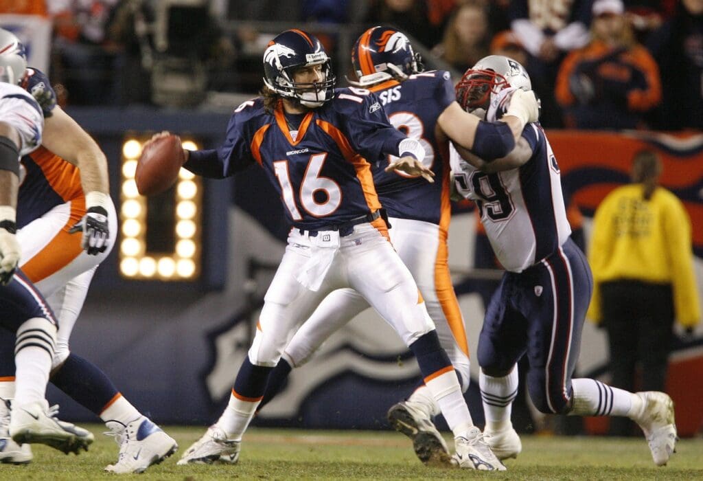 Jan 14, 2006; Denver, CO, USA; Denver Broncos quarterback (16) Jake Plummer throws in the pocket against New England Patriots in the third quarter during AFC Divisional Playoff game at Invesco Field at Mile High. The Broncos beat the Patriots 27-13.