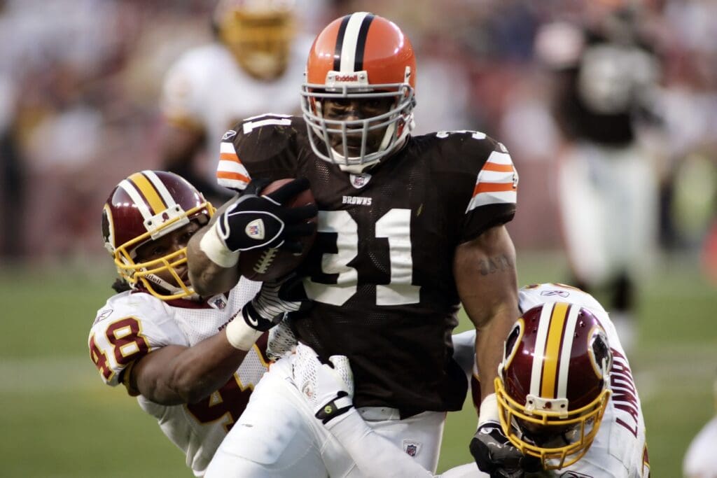 October 19, 2008; Landover, MD, USA; Cleveland Browns running back Jamal Lewis (31) is tackled by Washington Redskins safety Chris Horton (48) and safety LaRon Landry (30) in the third quarter at FedEx Field. The Redskins won 14-11.