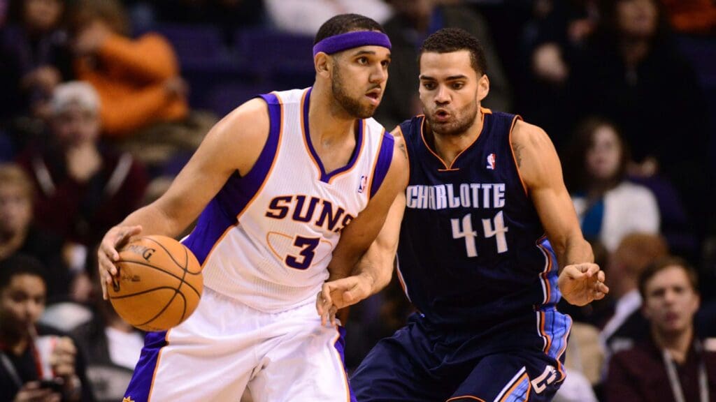 Dec. 19, 2012; Phoenix, AZ, USA: Phoenix Suns shooting guard Jared Dudley (3) drives the ball against Charlotte Bobcats shooting guard Jeffery Taylor (44) at the US Airways Center. The Suns defeated the Bobcats 121-104.