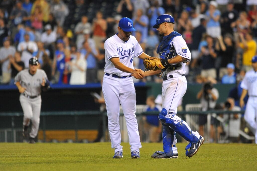 Aug 13, 2010; Kansas City, MO, USA; Kansas City Royals relief pitcher Joakim Soria (48) is congratulated by catcher Jason Kendall (18) as the Royals defeat the New York Yankees 4-3 at Kauffman Stadium.