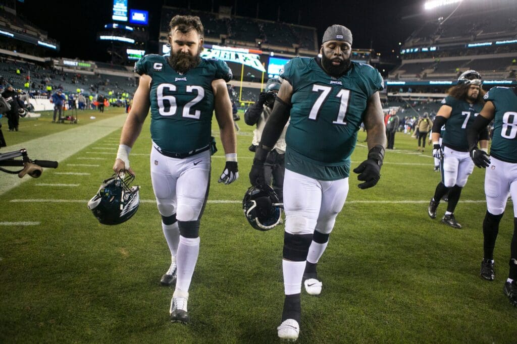 Philadelphia's Jason Kelce (62) and Jason Peters (71) hang their heads as they head toward the locker room tunnel after losing to the Seattle Seahawks 17-9 in 2020 at Lincoln Financial Field.