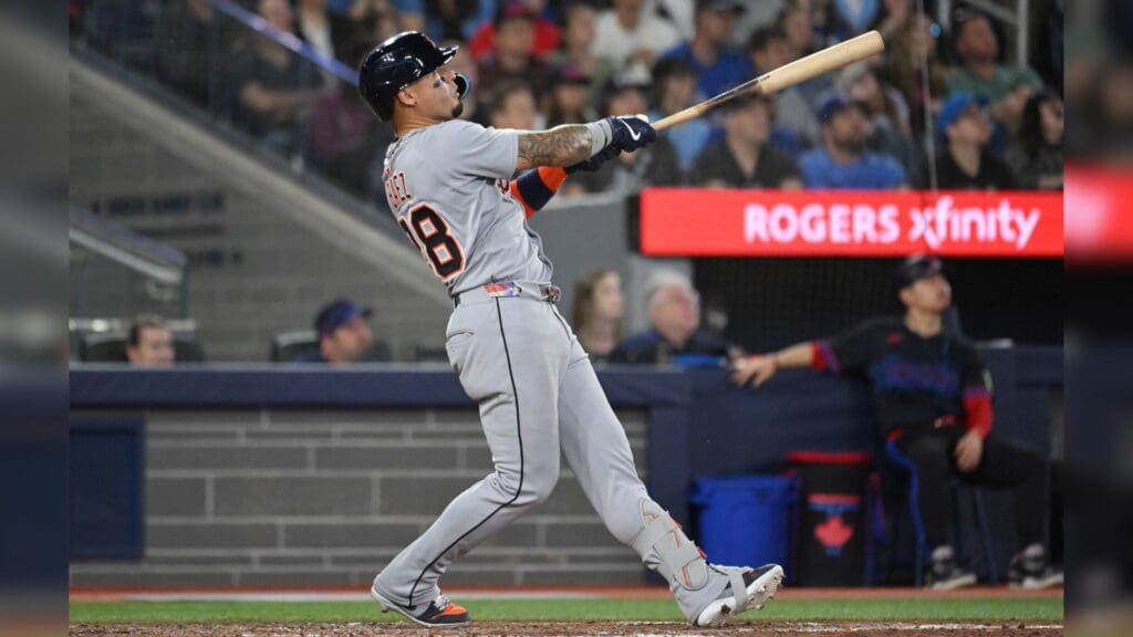 May 16, 2025; Toronto, Ontario, CAN; Detroit Tigers center fielder Javier Baez (28) hits a solo home run against the Toronto Blue Jays in the eighth inning at Rogers Centre.