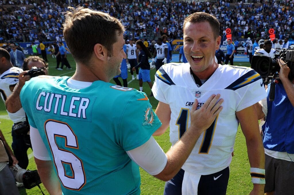 Sep 17, 2017; Carson, CA, USA; Miami Dolphins quarterback Jay Cutler (6) and Los Angeles Chargers quarterback Philip Rivers (17) meet at midfield following the game at StubHub Center.