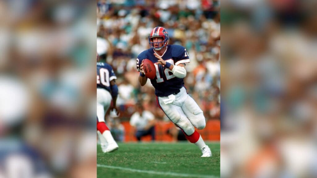 Oct 12, 1986; Miami, FL, USA; FILE PHOTO; Buffalo Bills quarterback Jim Kelly (12) in action against the Miami Dolphins at the Orange Bowl. Miami defeated Buffalo 27-14.