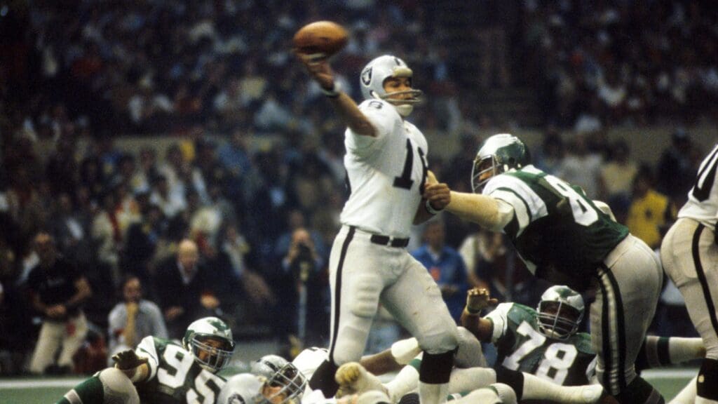 Jan 25, 1981; New Orleans, LA, USA; FILE PHOTO; Oakland Raiders quarterback Jim Plunkett (16) throws the ball against the Philadelphia Eagles in Super Bowl XV at the Superdome. The Raiders defeated the Eagles 27-10.
