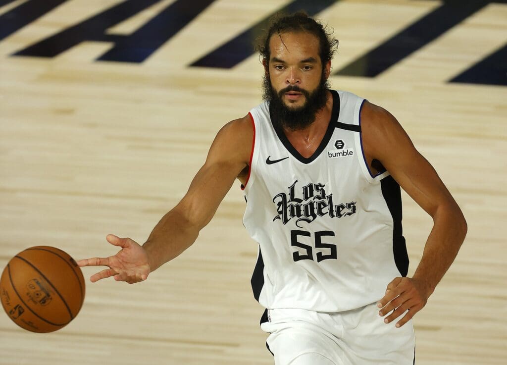 Joakim Noah #55 of the LA Clippers dribbles the ball against the Oklahoma City Thunder during overtime at The Field House at ESPN Wide World of Sports Complex.