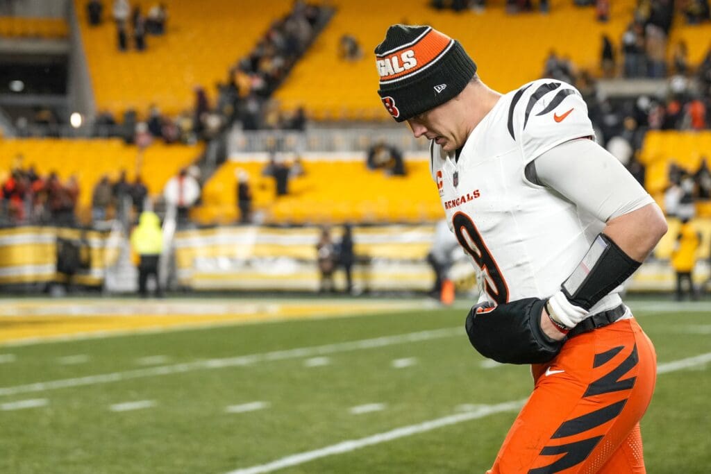 Jan 4, 2025; Pittsburgh, Pennsylvania, USA; Cincinnati Bengals quarterback Joe Burrow (9) runs for the locker room after a game against the Pittsburgh Steelers at Acrisure Stadium. The Bengals won 19-17 to finish the regular season at 9-8. Mandatory Credit: Sam Greene/USA TODAY Network via Imagn Images