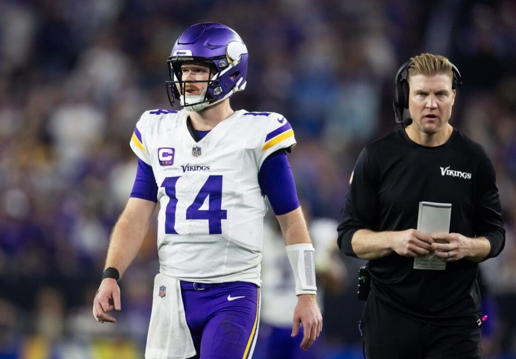 Jan 13, 2025; Glendale, AZ, USA; Minnesota Vikings quarterback Sam Darnold (14) with quarterbacks coach Josh McCown against the Los Angeles Rams during an NFC wild card game at State Farm Stadium. Mandatory Credit: Mark J. Rebilas-Imagn Images