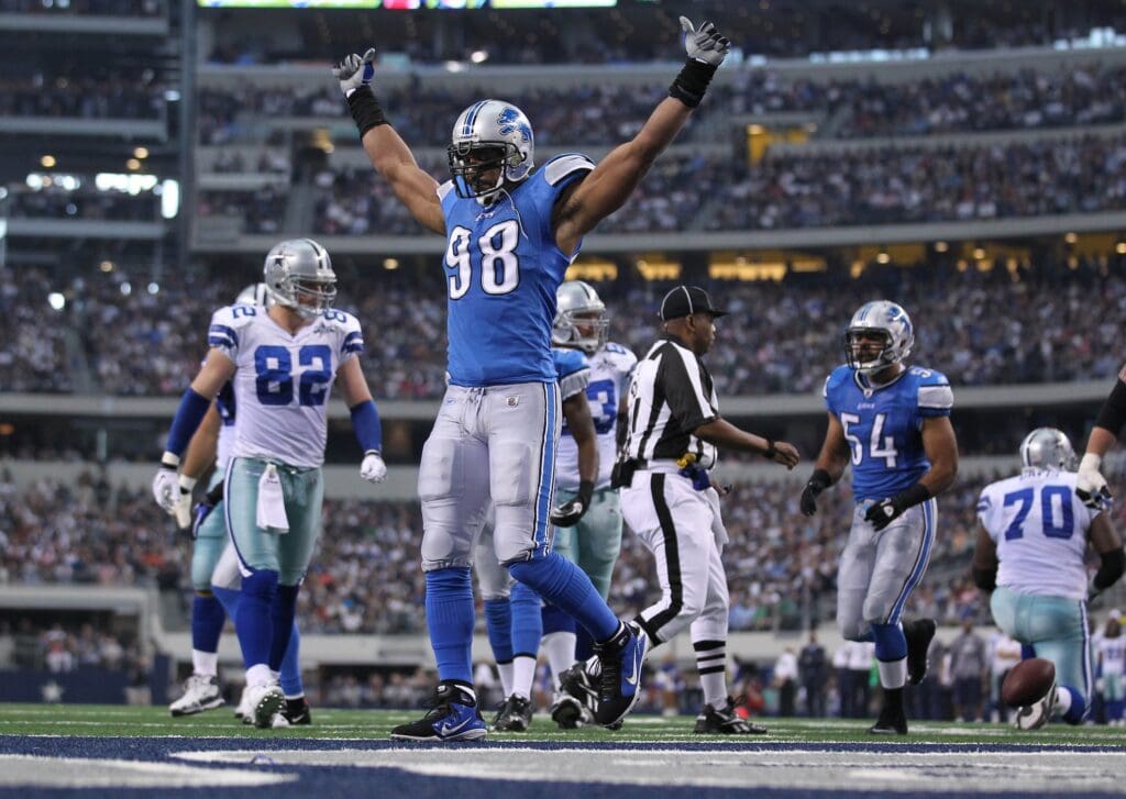 Nov 21, 2010; Arlington, TX, USA; Detroit Lions linebacker Julian Peterson (98) celebrates after a tackle for a loss in the first quarter against the Dallas Cowboys at Cowboys Stadium. The Cowboys beat the Lions 35-19. Mandatory Credit: Matthew Emmons- USA TODAY Sports