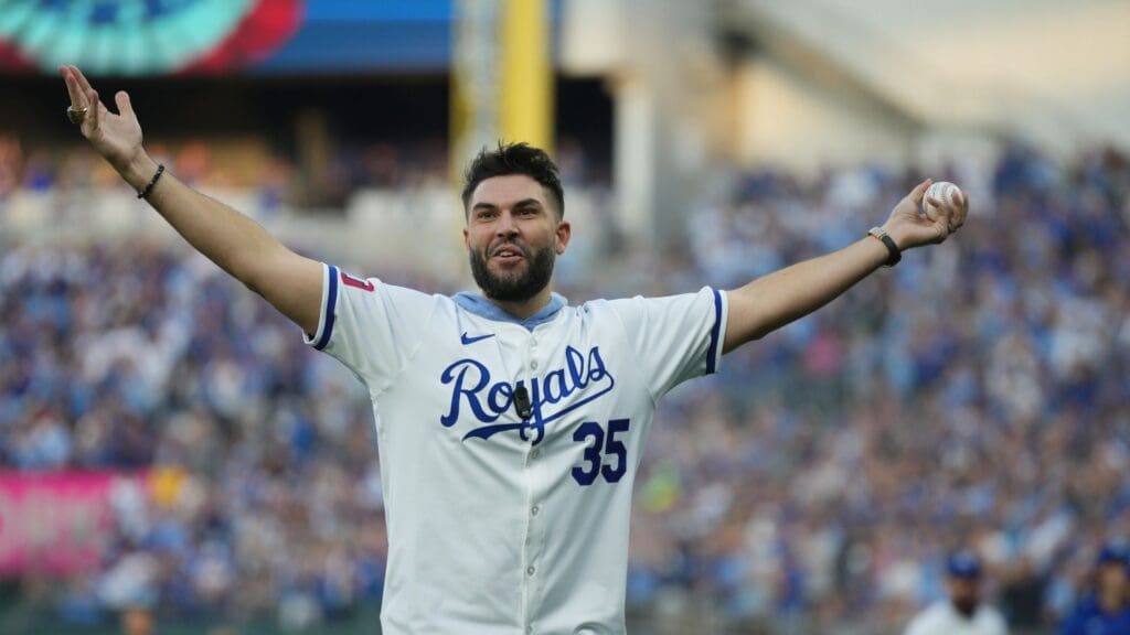 Oct 9, 2024; Kansas City, Missouri, USA; Form Kansas City Royals player Eric Hosmer throws out the cerominal first pitch before the game between the New York Yankees and the Kansas City Royals during game three of the NLDS for the 2024 MLB Playoffs at Kauffman Stadium
