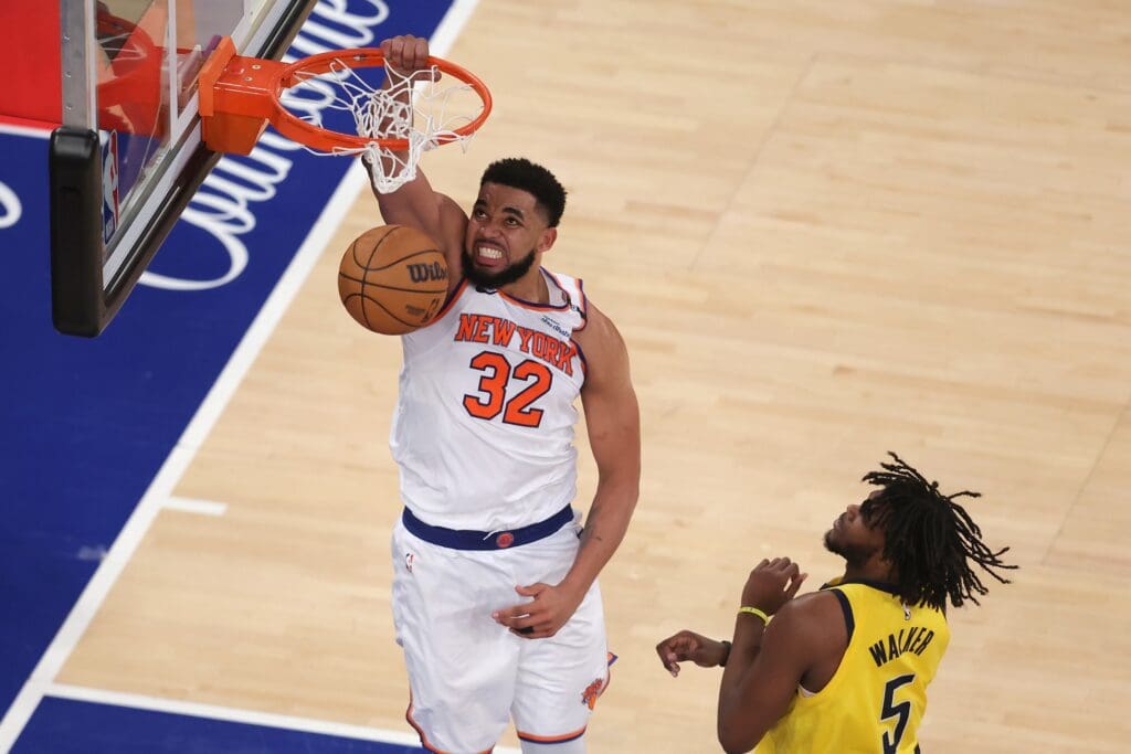May 29, 2025; New York, New York, USA; New York Knicks center Karl-Anthony Towns (32) dunks against Indiana Pacers forward Jarace Walker (5) in the fourth quarter during game five of the eastern conference finals for the 2025 NBA Playoffs at Madison Square Garden.