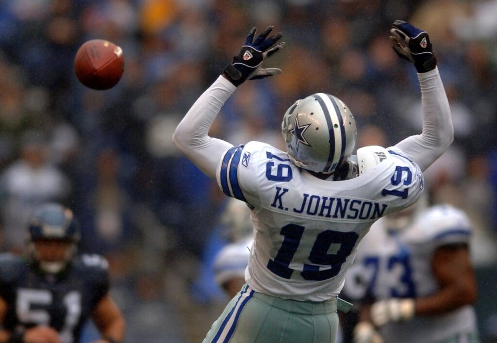 Oct 23, 2005; Seattle, Wash, USA; Dallas Cowboys wide receiver #19 Keyshawn Johnson leaps for a pass against the Seattle Seahawks in the first quarter at Qwest Field.