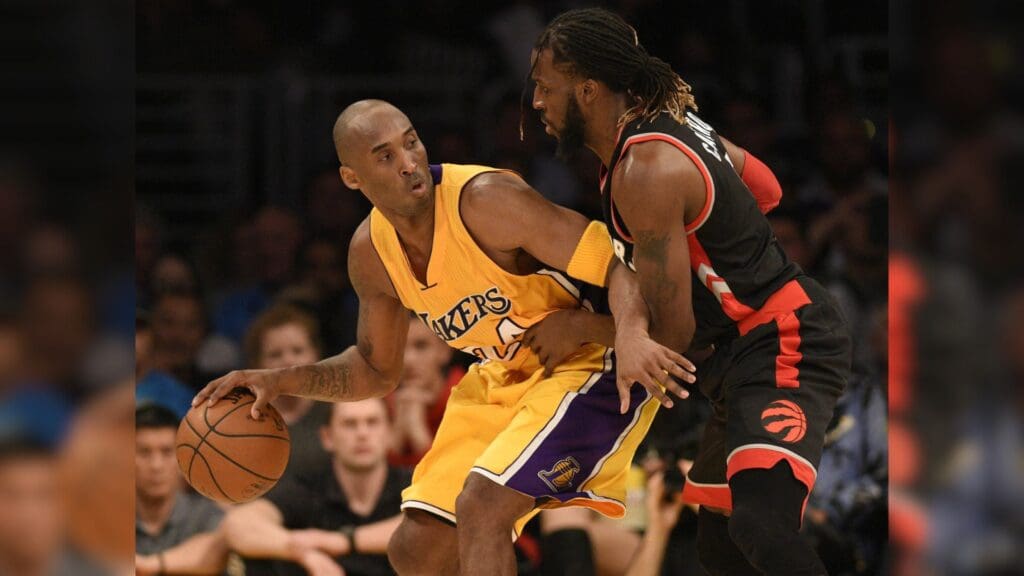 Nov 20, 2015; Los Angeles, CA, USA; Los Angeles Lakers guard Kobe Bryant (left) posts up on Toronto Raptors forward DeMarre Carroll (right) during the fourth quarter at Staples Center. The Toronto Raptors won 102-91.