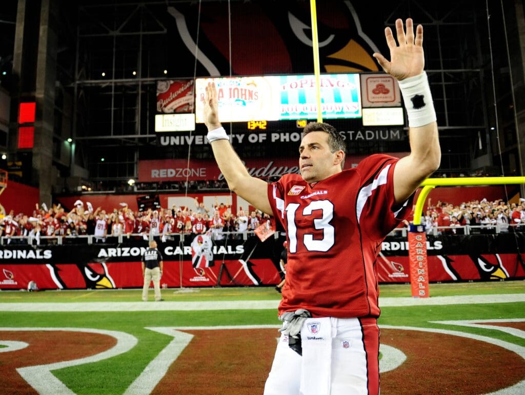 Jan. 10, 2010; Glendale, AZ, USA; Arizona Cardinals quarterback Kurt Warner (13) celebrates following the game against the Green Bay Packers in the 2010 NFC wild card playoff game at University of Phoenix Stadium. Arizona defeated Green Bay 51-45 in overtime.