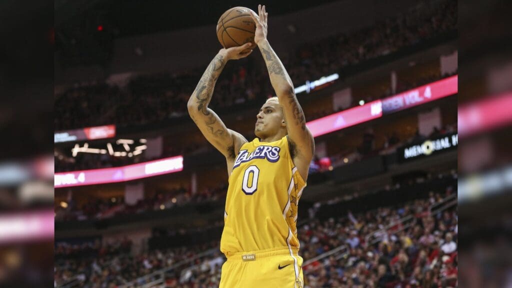 Jan 18, 2020; Houston, Texas, USA; Los Angeles Lakers forward Kyle Kuzma (0) shoots the ball against the Houston Rockets during the fourth quarter at Toyota Center.