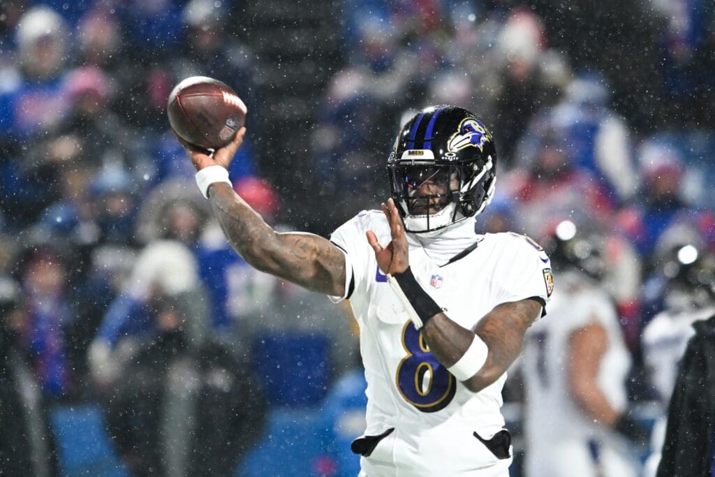 Jan 19, 2025; Orchard Park, New York, USA; Baltimore Ravens quarterback Lamar Jackson (8) throws the ball during warm ups before the game against the Buffalo Bills in a 2025 AFC divisional round game at Highmark Stadium.